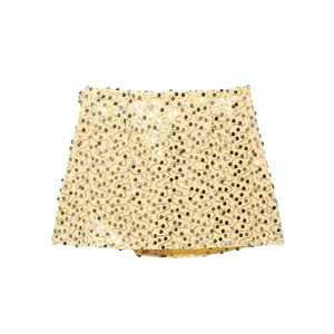 Detailed view of yellow mini skirt with decorative black and silver wave sequins