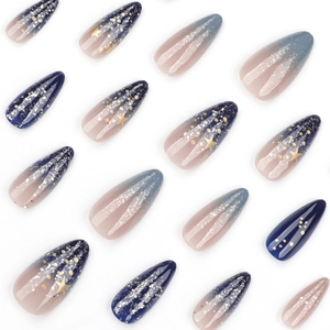 Starry sky almond press-on nails with blue gradient, gold stars, and silver glitter finish
