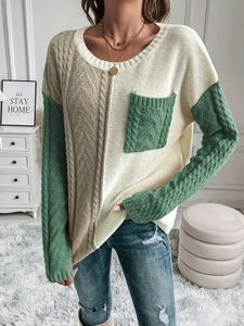 Women's crewneck cable knit sweater in cream and green colorblock with pocket