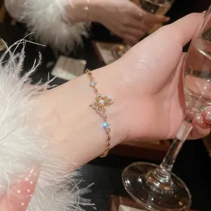 Elegant 18k gold plated butterfly ring with sparkling zircons worn by a woman