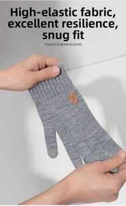 Close-up of grey high-elastic knit gloves showing touch screen tips and stretch fabric