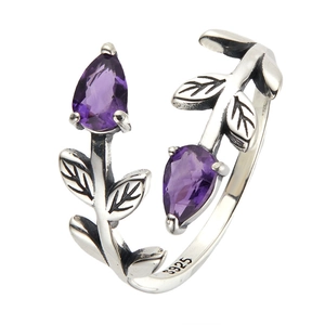 Macro shot of S925 sterling silver ring with purple amethyst pear-shaped gemstones