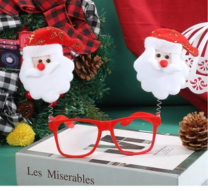 Detailed view of red Christmas glasses featuring springy Santa Clause figures on top