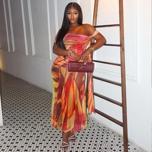 Bohemian off-shoulder maxi dress with vibrant abstract print and ruched waist design