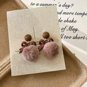 Retro bow knot earrings with plush pom pom charms for women in autumn winter style