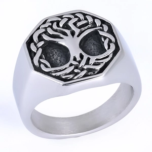 Macro side view of vintage stainless steel tree of life signet ring with oxidised finish