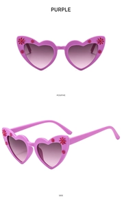 Detail view showing front and side of purple heart-shaped kids sunglasses with red flowers