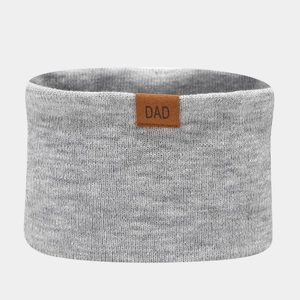 Detailed knit grey scarf with brown leather DAD patch label showing warm texture