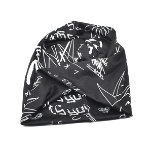 Trendy black slouchy beanie with white graffiti letter print for street style fashion