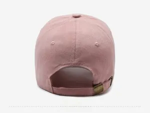 Detailed back view of pink cotton baseball cap featuring adjustable metal buckle strap
