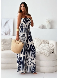 Close-up of black and white abstract floral print on elegant off-shoulder jumpsuit