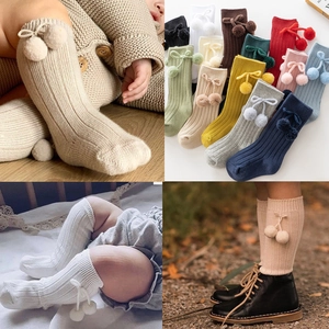 Baby knee-high knit socks with cherry pom-poms in various colors for 2025 autumn