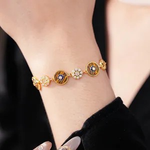 Vintage gold-plated bracelet with round tiger eye stone and shimmering cubic zirconia