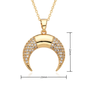 Macro shot showing dimensions 22mm by 23mm of gold crescent pendant with white zircons