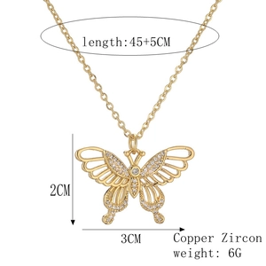 Detail of copper and zircon butterfly necklace with 45+5cm chain and 3x2cm pendant dimensions