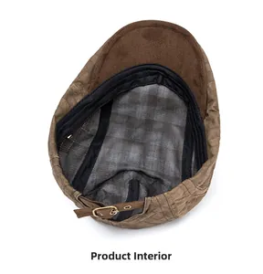 Detail of the inner lining with checkered pattern and adjustable buckle on the newsboy cap