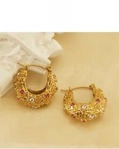 Macro detail of 18K gold plated hoop earrings with pink and white crystal zircon stones