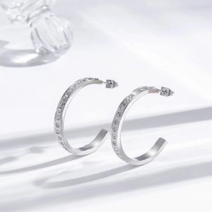 Minimalist C-shaped stainless steel earrings with micro-inlaid rhinestones on white background