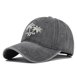 Detail of coconut tree embroidery and SUMMER text on washed grey baseball cap