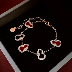 Luxury 18K gold plated Wulu bracelet with red agate style gourd charms and zircons