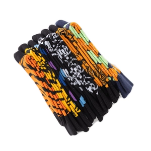Detail of colorful knitted crew socks with tiger stripes, polka dots and patterns