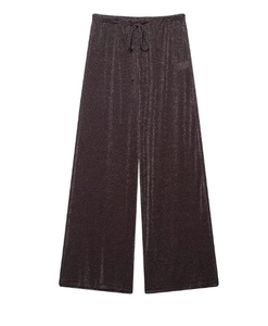 Détail d'un pantalon large en tissu pailleté gris foncé avec taille à cordon