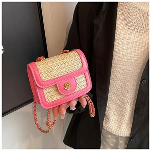 Detail of pink PU leather and beige woven straw mini bag with gold floral clasp