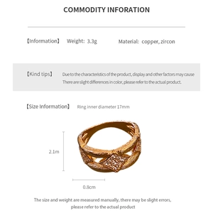 Detail of vintage rhombus zircon ring showing interlaced copper design and gold plating