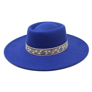 Detail of royal blue wool fedora with bohemian geometric jacquard band and flat wide brim