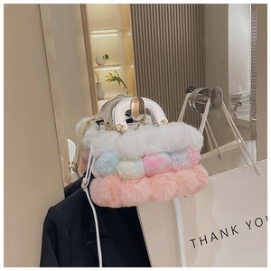 Detail of multi-colored faux fur handbag with white leather handle and metal chain strap