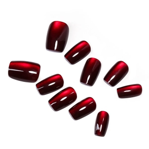 Deep red cat-eye press-on nails set with high gloss finish on white background