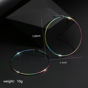 Detailed view of 70mm colorful rainbow titanium steel hoop earrings with star charms