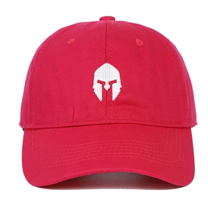 Close-up of white Spartan helmet embroidery on a high-quality red cotton baseball cap