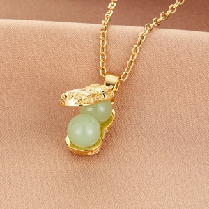 Titanium steel gold necklace featuring an openable peanut pendant with green beads