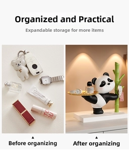Detail of panda figurine holding a golden tray and green bamboo hook for key storage