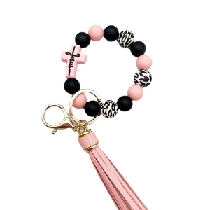 Pink and black silicone bead keychain bracelet with Jesus cross charm and leather tassel