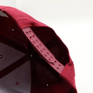 Burgundy flat brim hip-hop cap with adjustable plastic snapback and cotton fabric texture