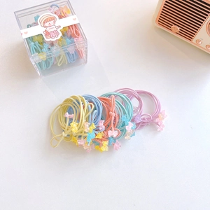 Colorful elastic hair ties with cute bear charms in a transparent storage box for girls
