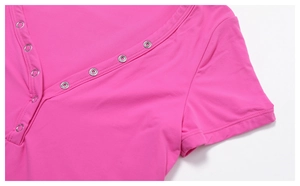 Detail view of deep pink yoga t-shirt featuring V-neckline with silver metal eyelets