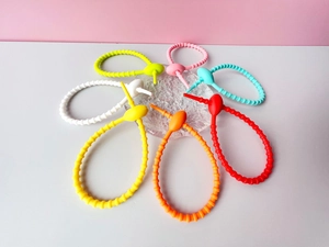 Colorful silicone cable ties arranged in floral pattern for wire management and DIY projects