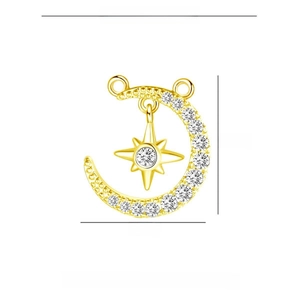 Macro detail of gold star and moon pendant with copper and zircon material specifications