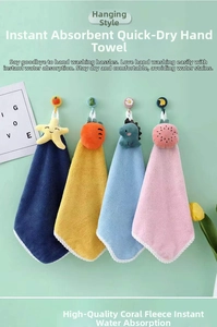 Close-up of four hanging thick coral fleece hand towels with cute animal designs