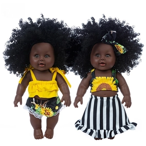 Realistic 12-inch African American baby dolls in yellow sunflower outfits on white background