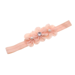 Detail of pink chiffon flower headband featuring soft pearls and a sparkling rhinestone