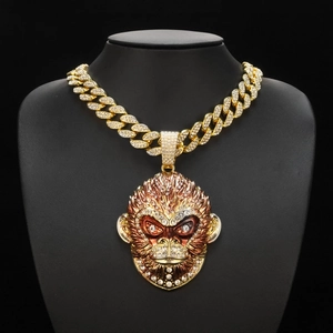 Close-up of golden Sun Wukong pendant with sparkling rhinestones on black bust