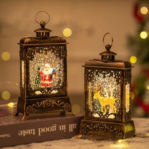 Vintage Christmas lantern decorations with snow scene and reindeer in warm bronze finish