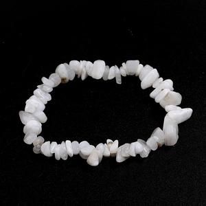 Macro detail of natural white irregular agate stone beads on elastic bracelet