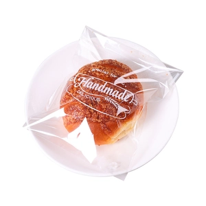 Handmade bread packed in a transparent self-adhesive bag with white decorative typography