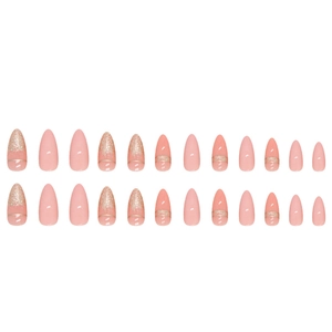 Almond-shaped peach pink press-on nails with gold glitter gradient and metallic accents