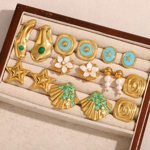 Detailed set of 18K gold-plated earrings with shell, pearl, and floral designs in a box